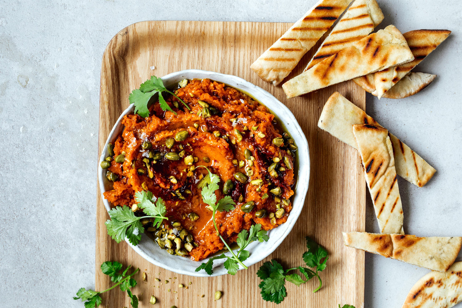 Crushed carrot dip spiced with coriander and harissa